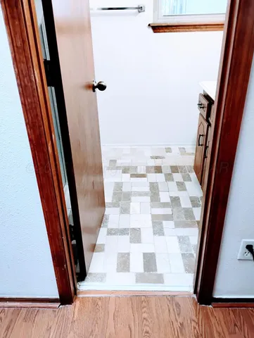 a bathroom with a black and white checkered floor