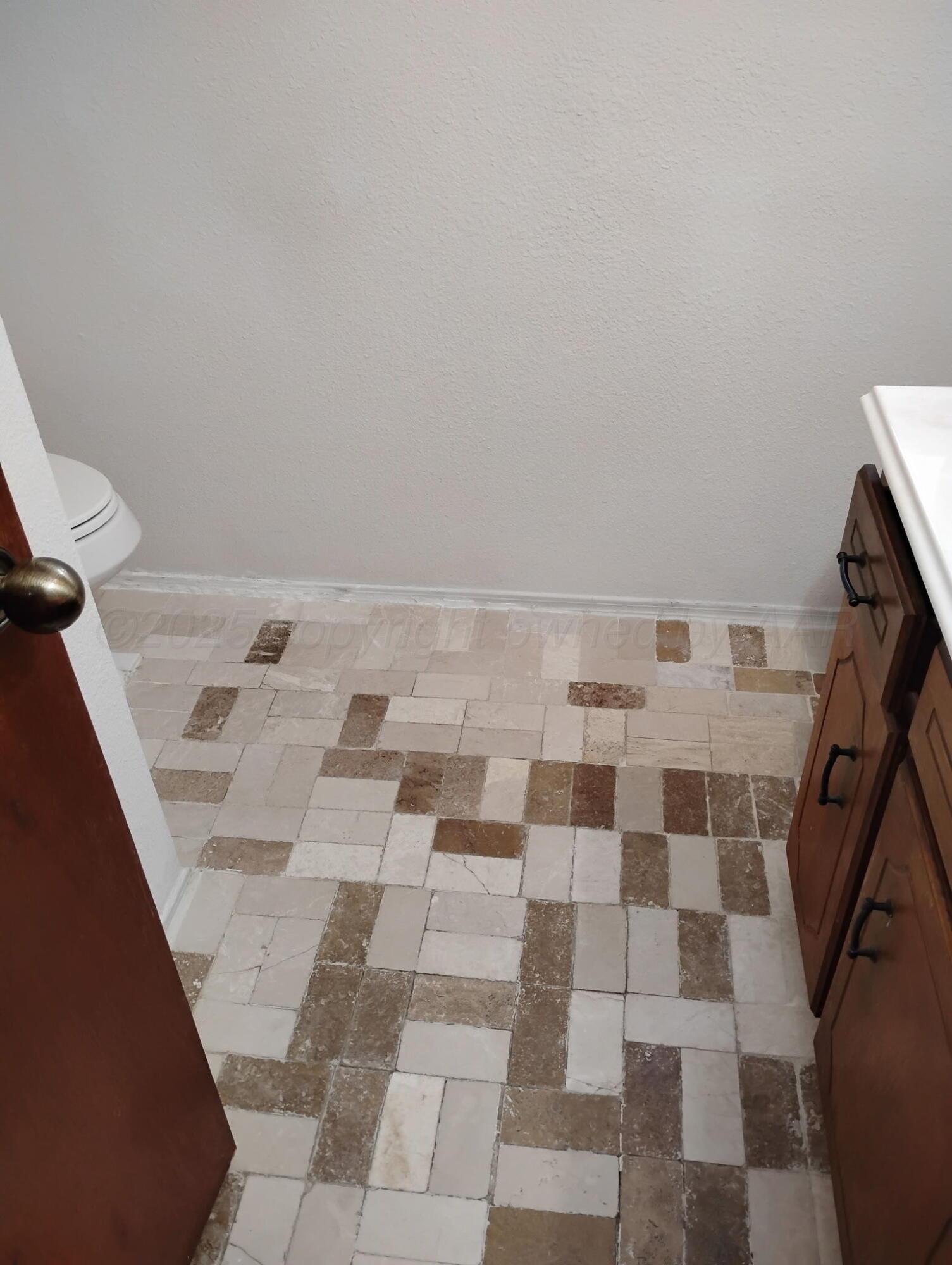 3100 Janet Drive Amarillo, TX 79109 - Photo 16 of 22 a bathroom with a black and white checkered floor