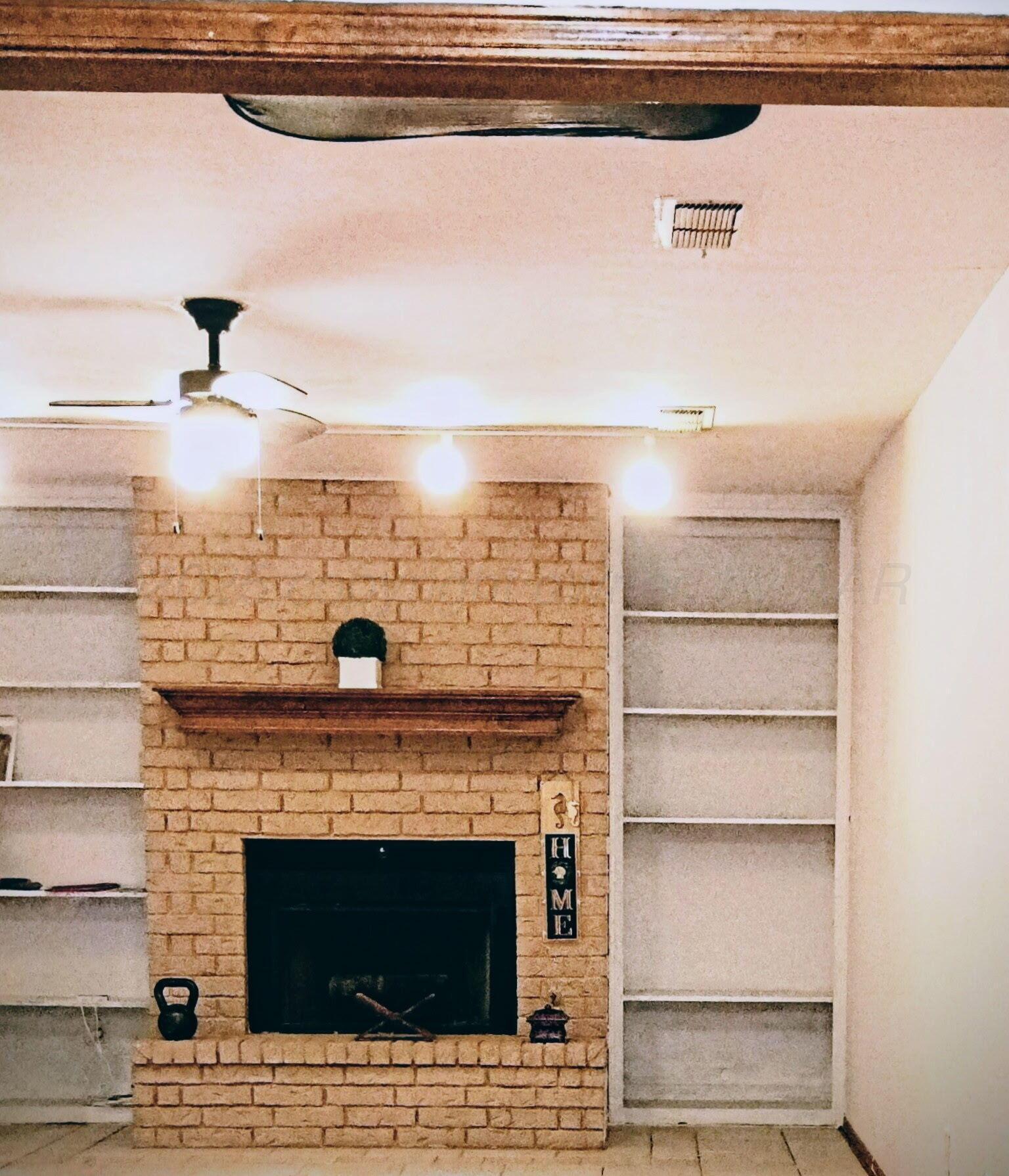 3100 Janet Drive Amarillo, TX 79109 - Photo 5 of 22 a living room with furniture and a fireplace