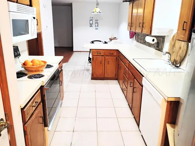a dining room with furniture and a chandelier