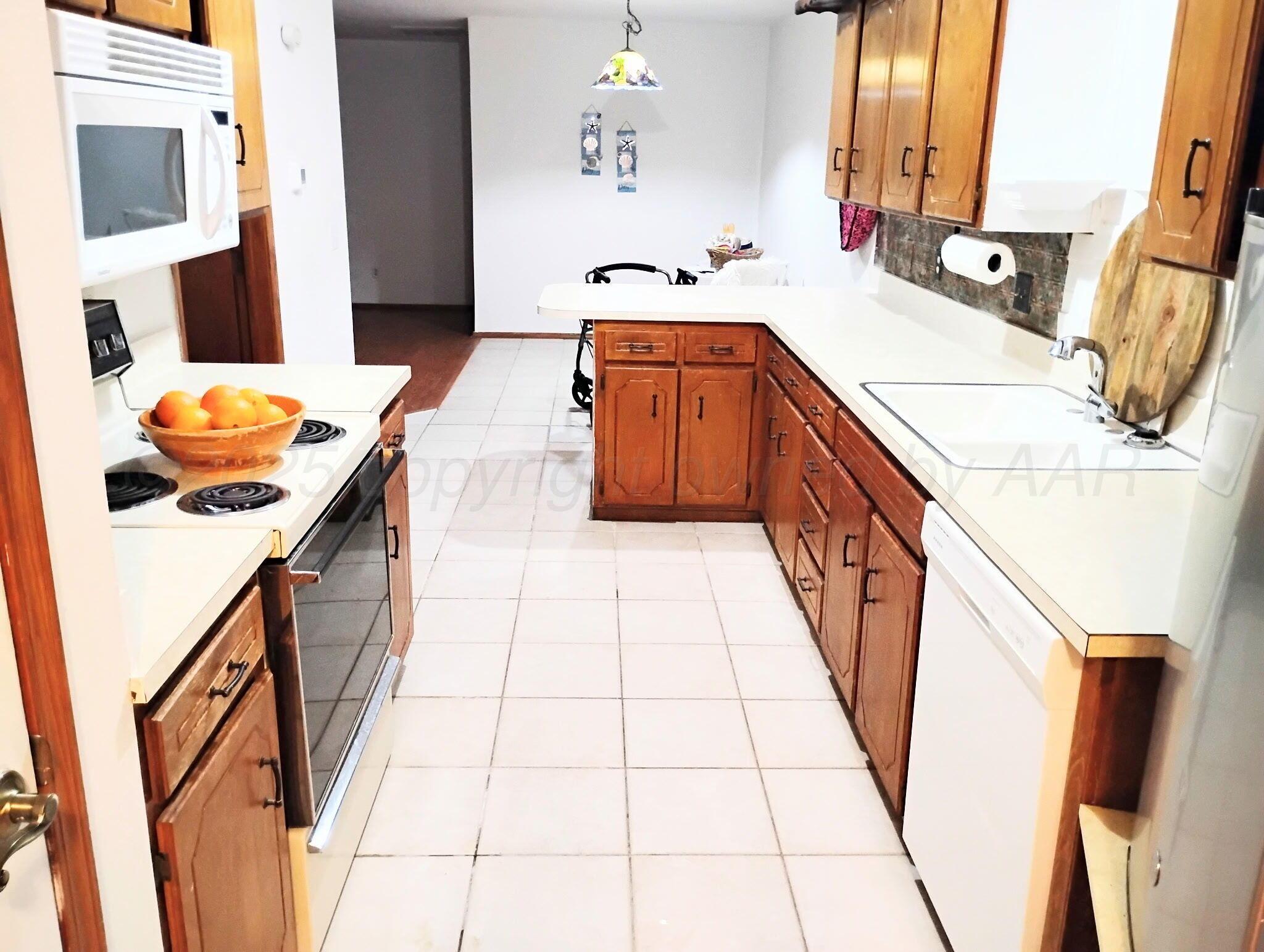 3100 Janet Drive Amarillo, TX 79109 - Photo 8 of 22 a bathroom with a sink a mirror and shower