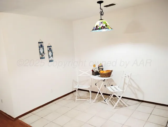 a view of a chairs and table in a room