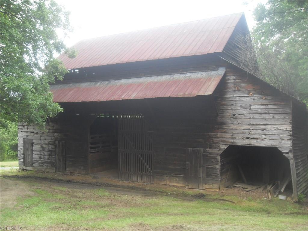 1410 Holly Grove Road Lexington, NC 27292 - Photo 2 of 28 This is an amazing 3 level barn with stalls. This barn is built with hand hewed beams and built to last.