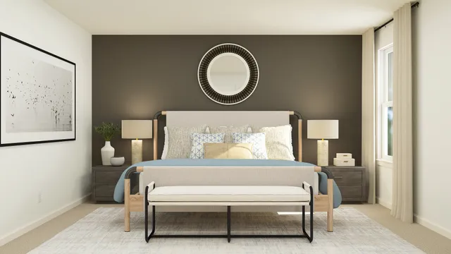 a bedroom with a bed and a painting on the wall