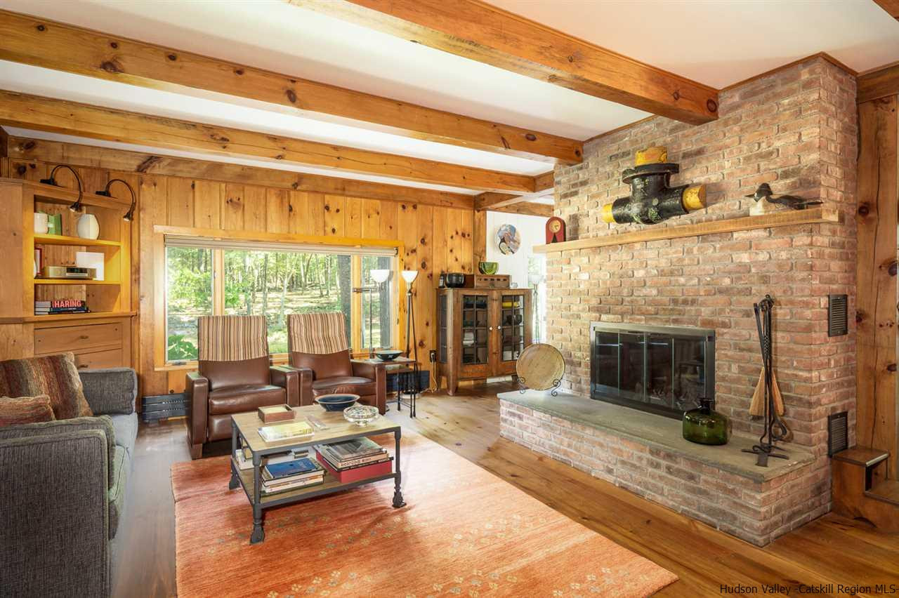 45 Pratt Road Stone Ridge, NY 12484 - Photo 20 of 35 a living room with furniture large window and fireplace