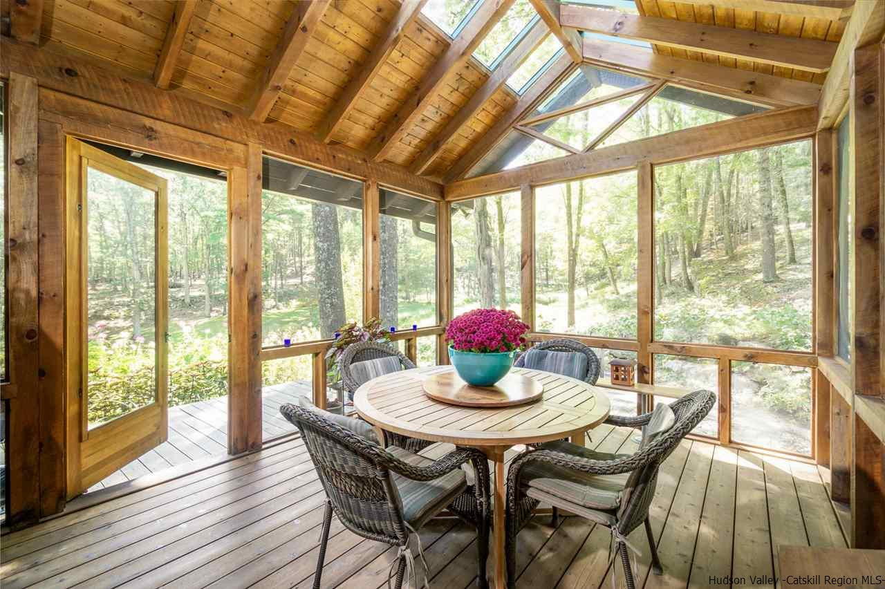 45 Pratt Road Stone Ridge, NY 12484 - Photo 23 of 35 a dining room with furniture window and wooden floor