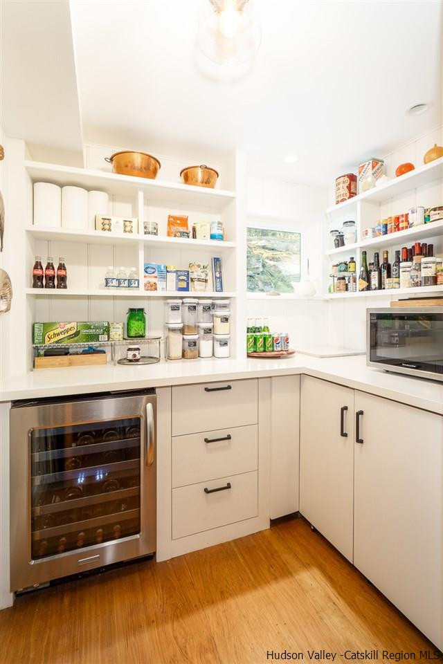 45 Pratt Road Stone Ridge, NY 12484 - Photo 28 of 35 a kitchen with stainless steel appliances a stove and a window