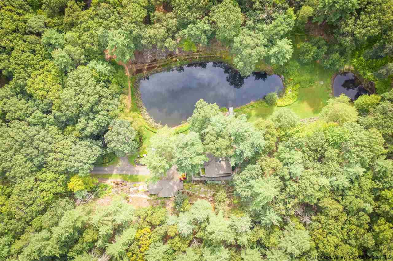 45 Pratt Road Stone Ridge, NY 12484 - Photo 4 of 35 a backyard of a house with a yard and outdoor seating