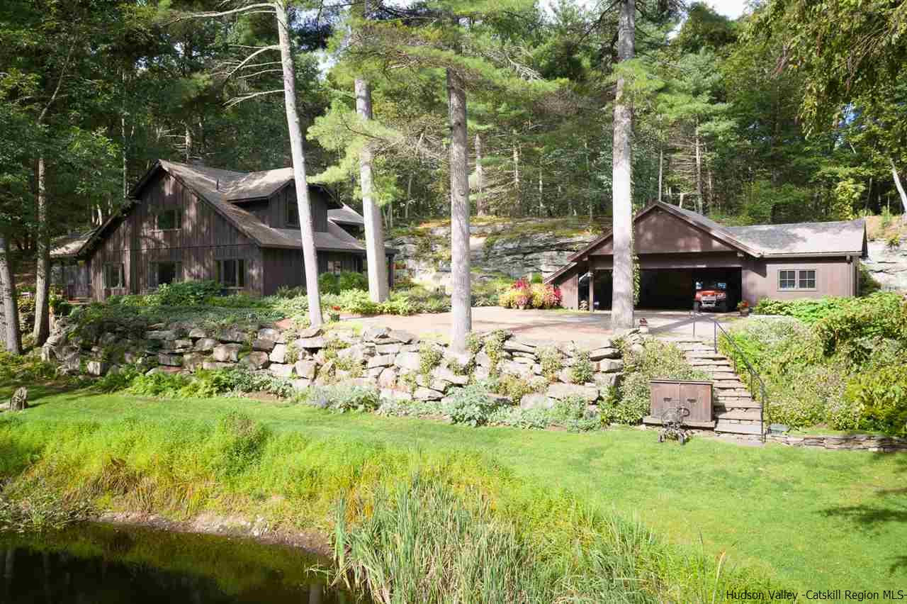 45 Pratt Road Stone Ridge, NY 12484 - Photo 9 of 35 a backyard of a house with table and chairs and potted plants