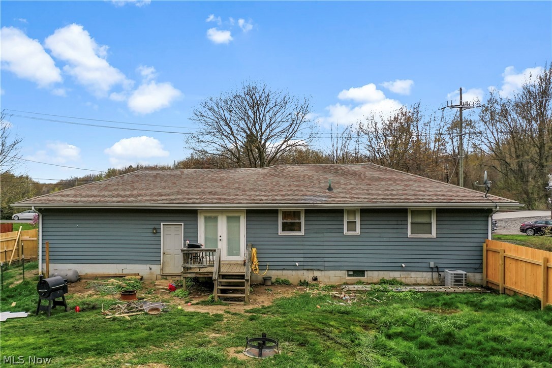 346 Amboy Road Conneaut, OH 44030 - Photo 7 of 41 Rear view of house with a deck and a lawn