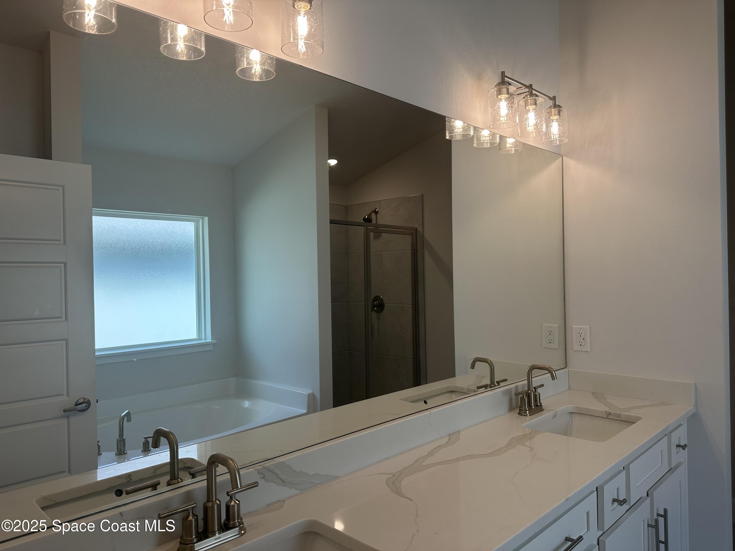 915 Kylar Drive Palm Bay, FL 32907 - Photo 12 of 15 a bathroom with a sink and a mirror