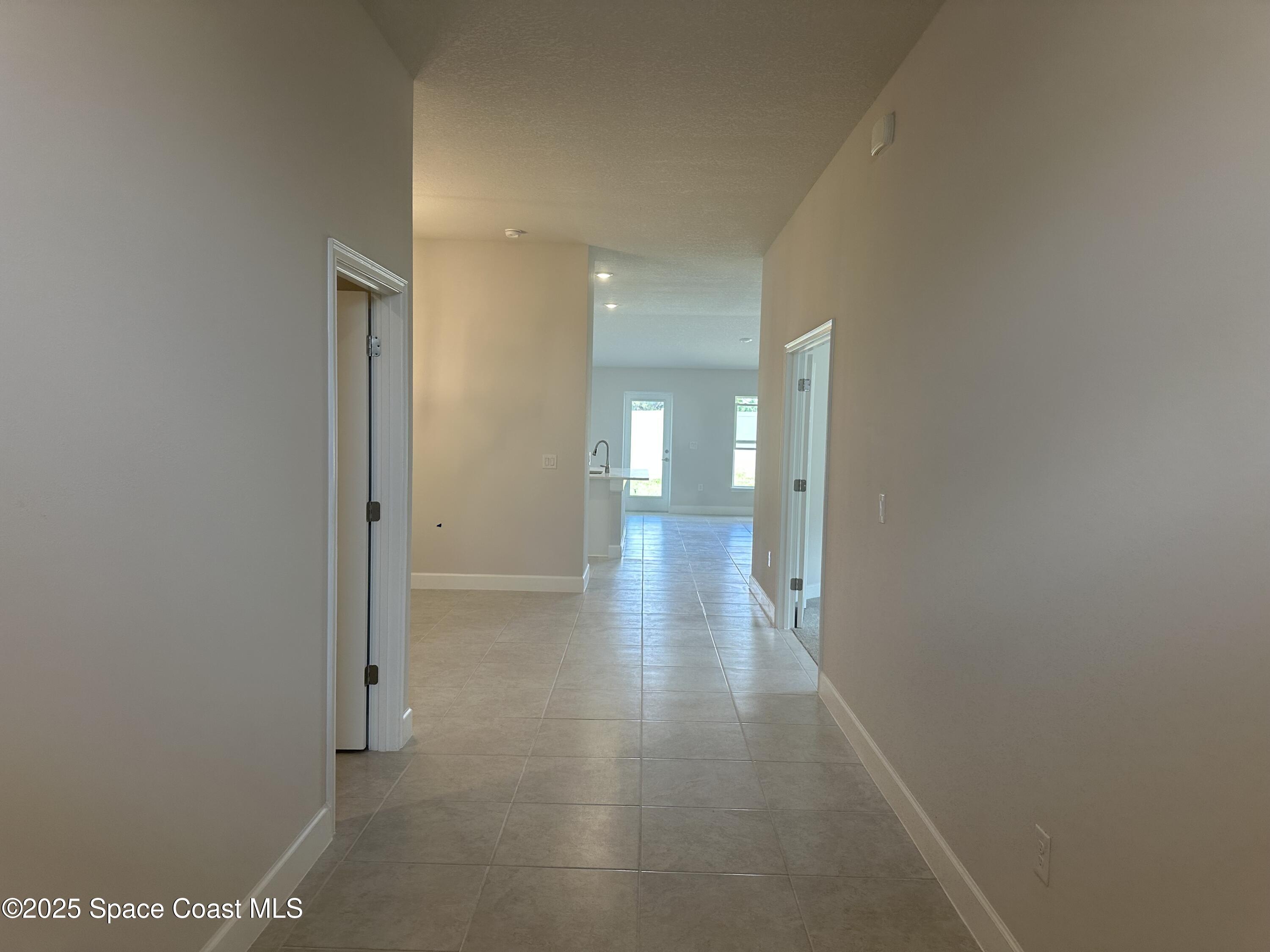 915 Kylar Drive Palm Bay, FL 32907 - Photo 2 of 15 a view of a hallway with wooden floor