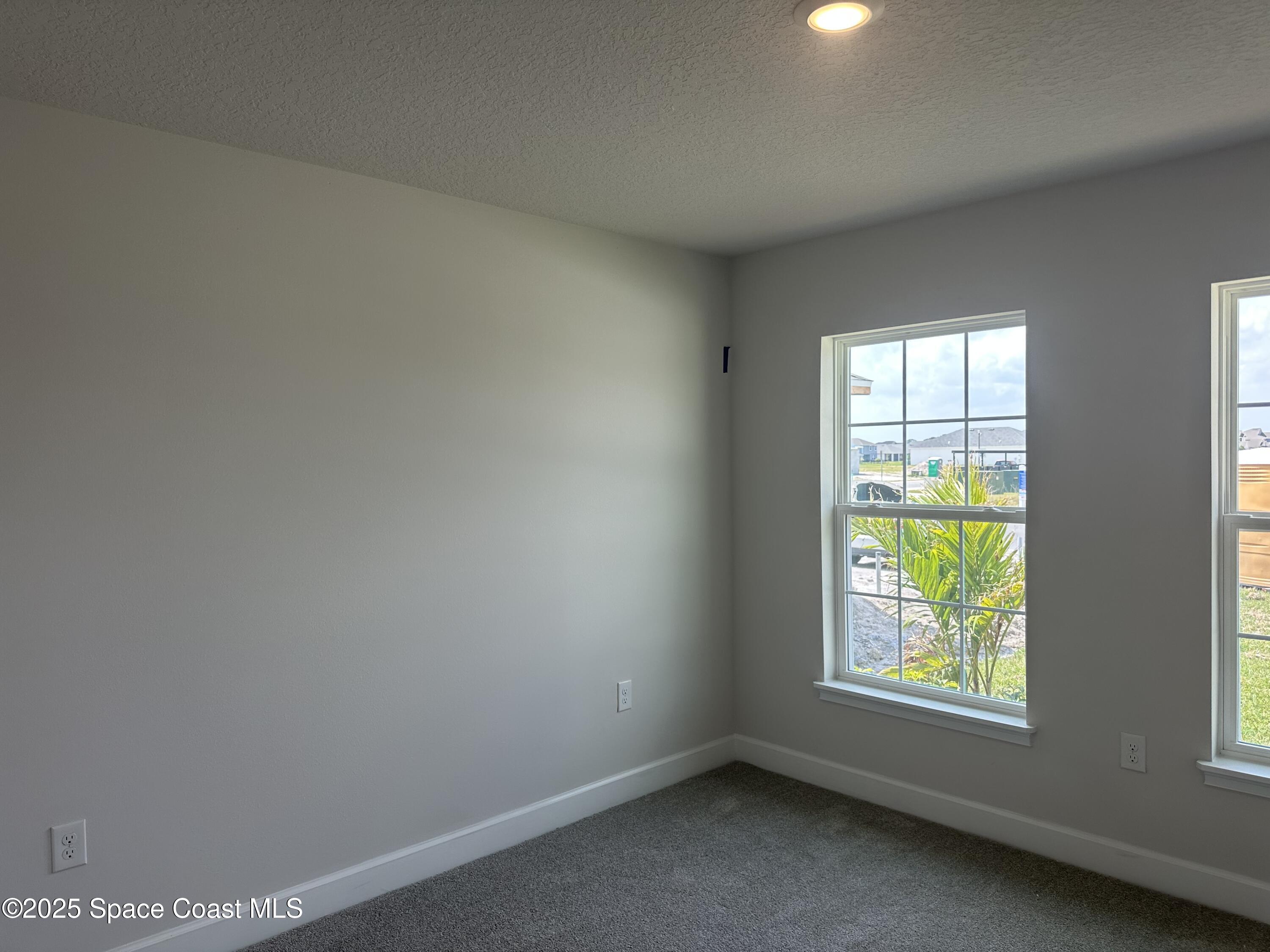 915 Kylar Drive Palm Bay, FL 32907 - Photo 8 of 15 an empty room with windows