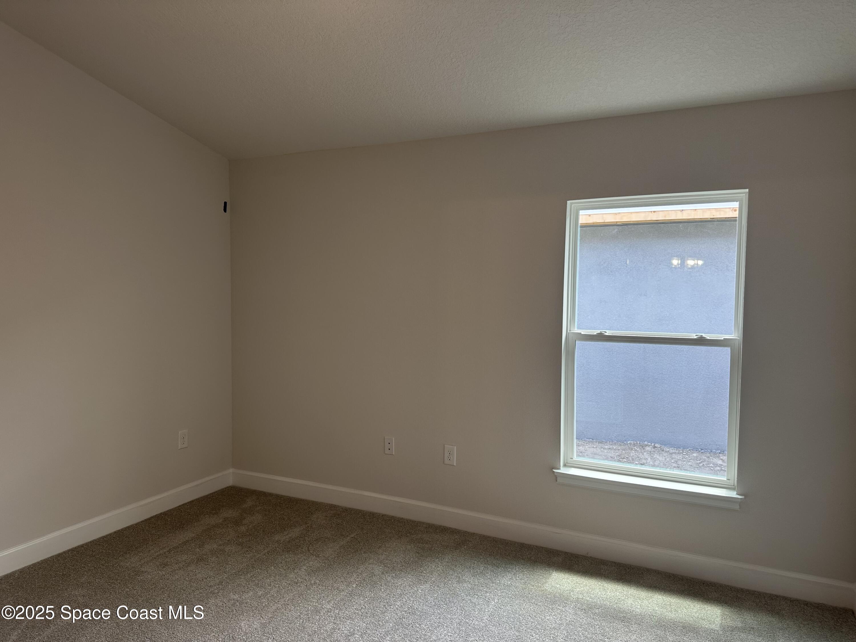 915 Kylar Drive Palm Bay, FL 32907 - Photo 10 of 15 an empty room with a window