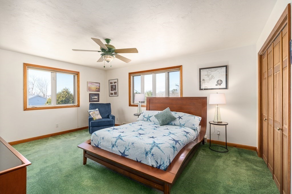 129 Thatcher Road Gloucester, MA 01930 - Photo 15 of 31 a bedroom with a bed and window