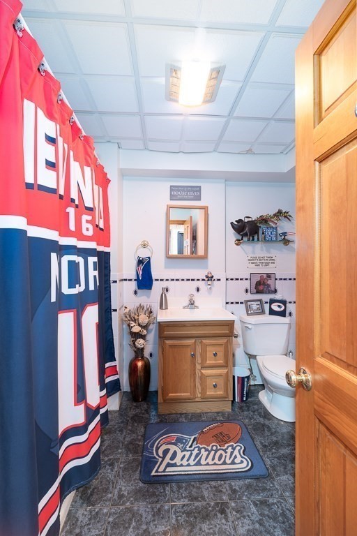 129 Thatcher Road Gloucester, MA 01930 - Photo 23 of 31 a room with kitchen island a stove a sink and a window