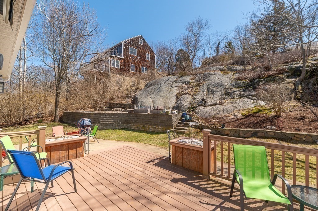 129 Thatcher Road Gloucester, MA 01930 - Photo 27 of 31 a view of a chairs and table on the wooden deck