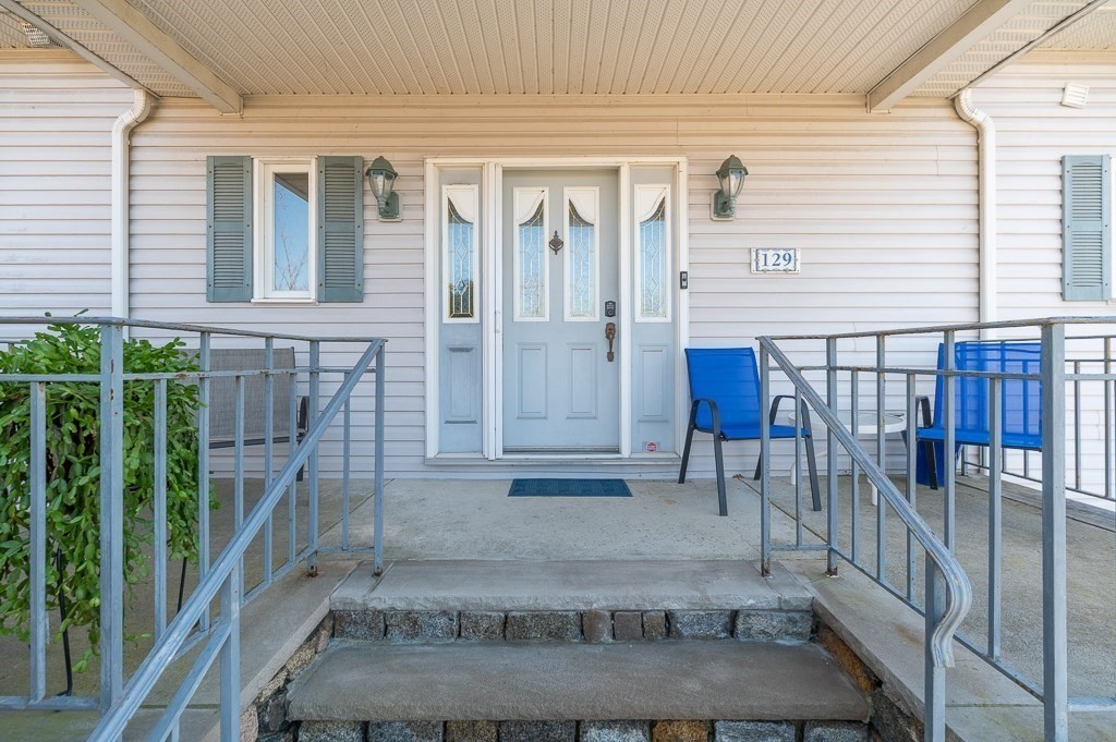 129 Thatcher Road Gloucester, MA 01930 - Photo 6 of 31 a view of front door of house with outdoor seating