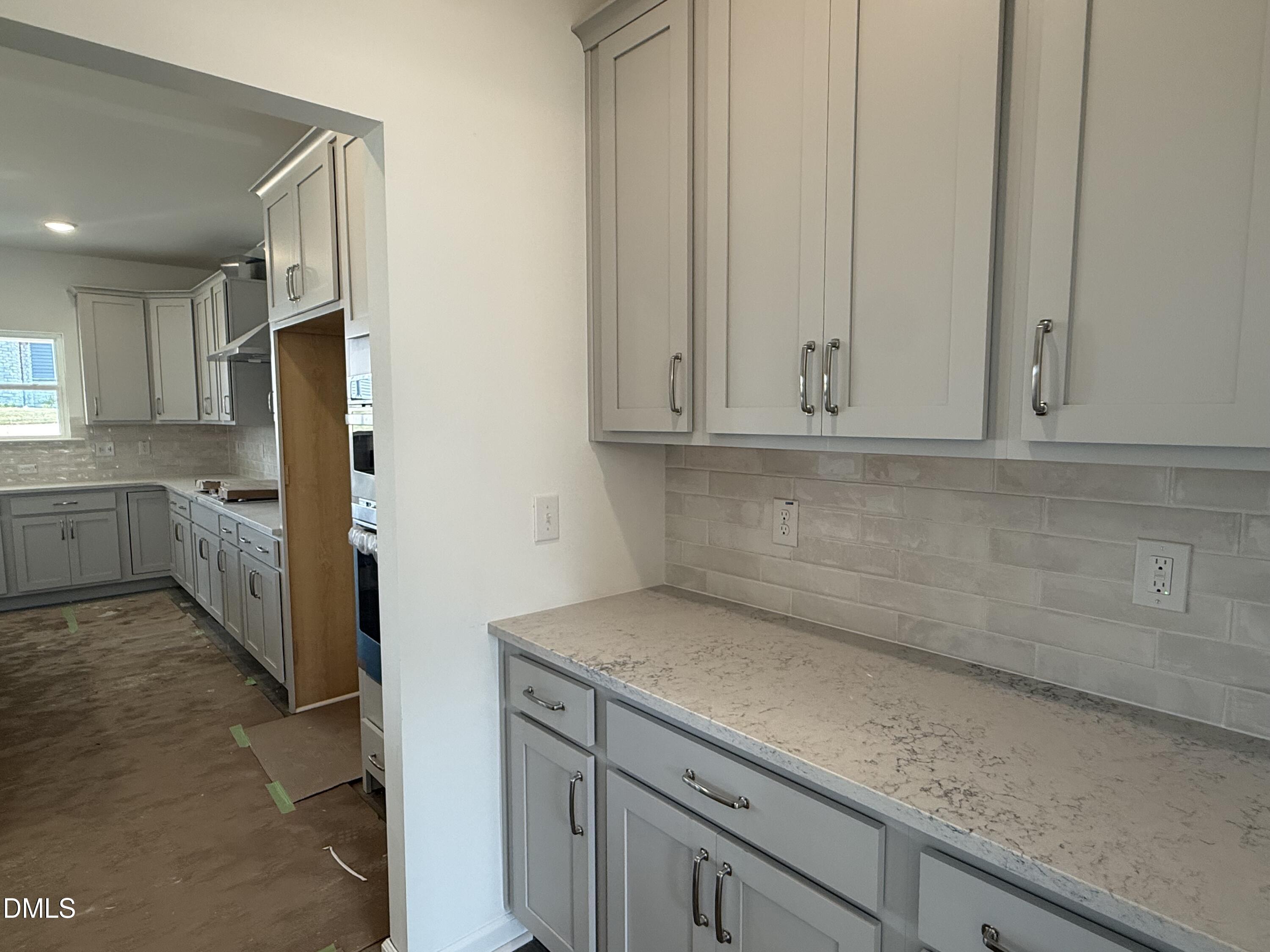 721 Compeer Way, Unit 35 Rolesville, NC 27571 - Photo 4 of 37 a view of a kitchen with white cabinets