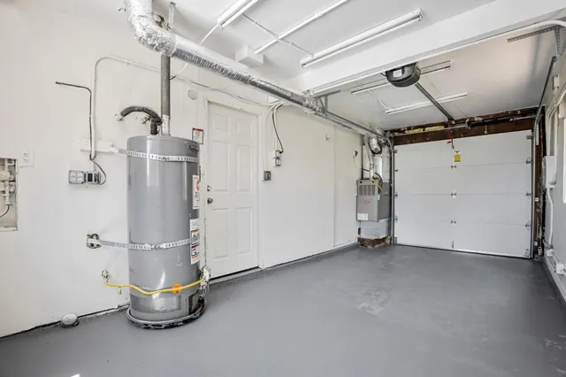 an aerial view of a swimming pool with outdoor seating
