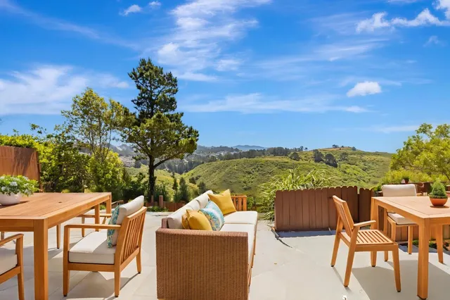 a view of a city with mountains in the background