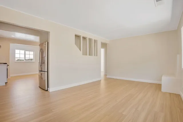 a bathroom with a toilet a sink and a window