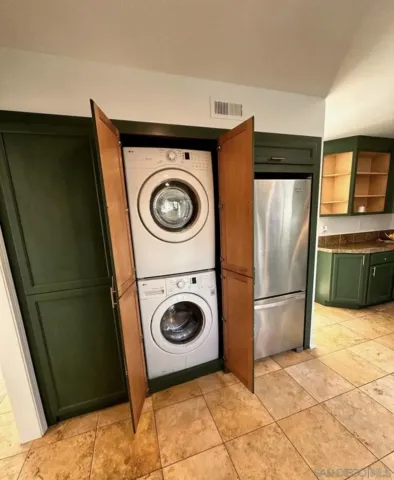 a bathroom with a sink toilet a mirror and shower