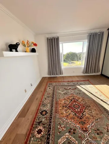 a bedroom with a bed and a large mirror