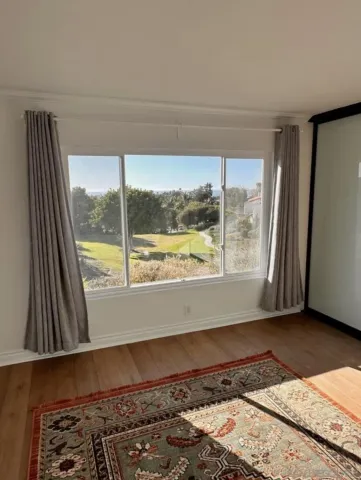 a view of an empty room and window