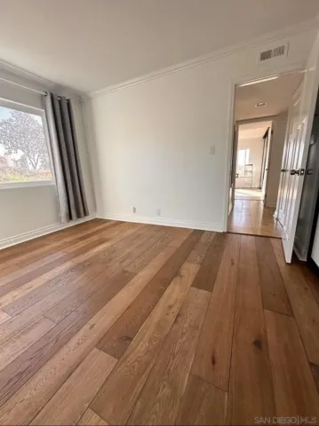 a bathroom with a double vanity sink a toilet and a mirror