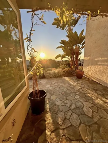 an aerial view of a house with a swimming pool outdoor seating and yard