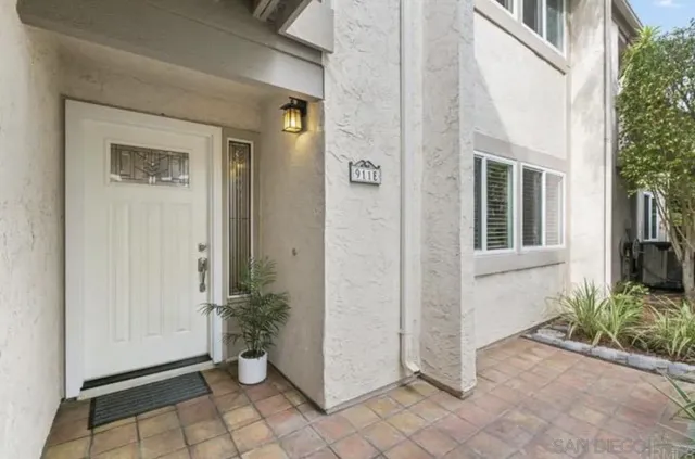 a living room with furniture fireplace and window