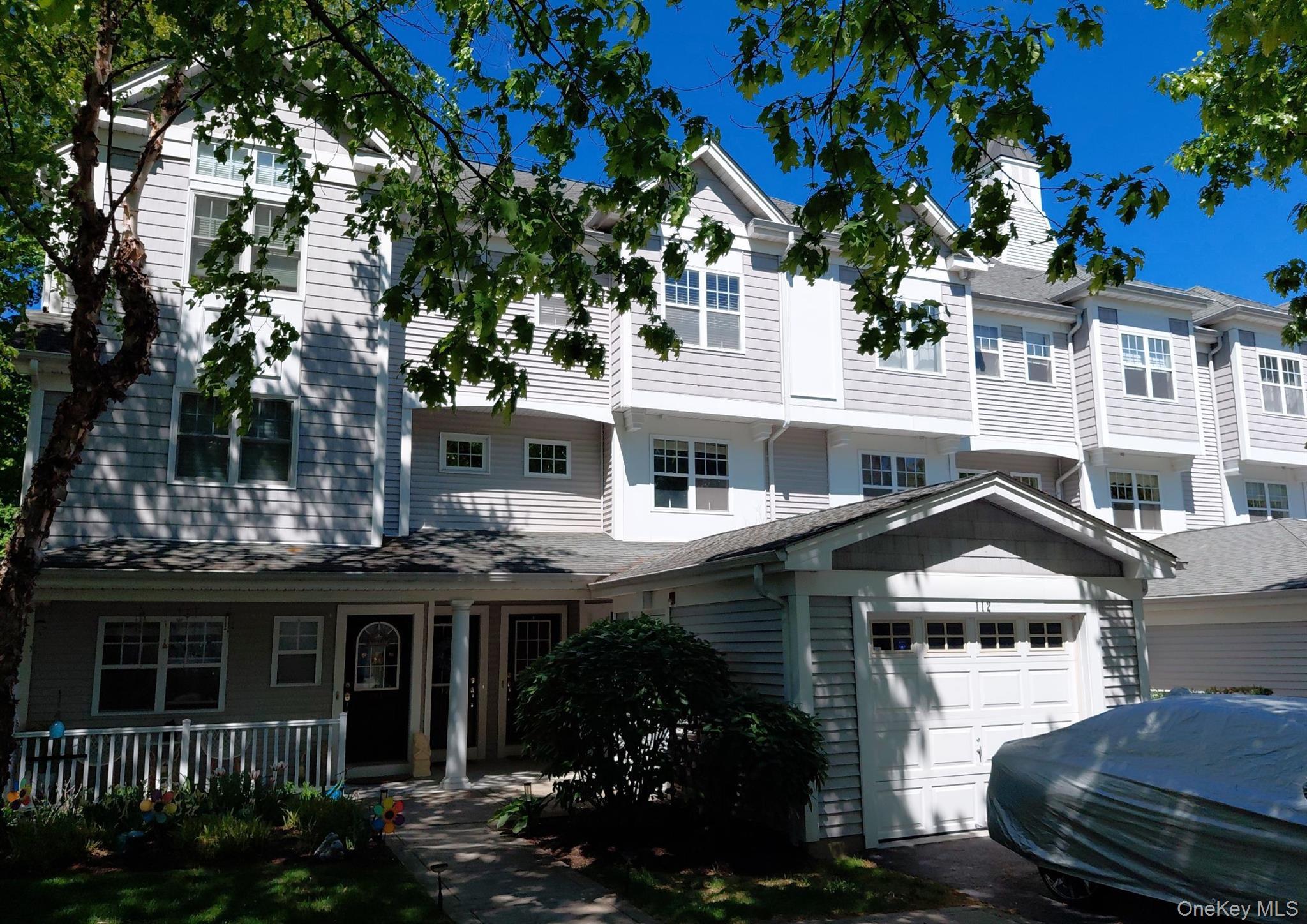 112 Riverbend Drive, Unit 88 Peekskill, NY 10566 - Photo 1 of 4 a front view of a house with a yard