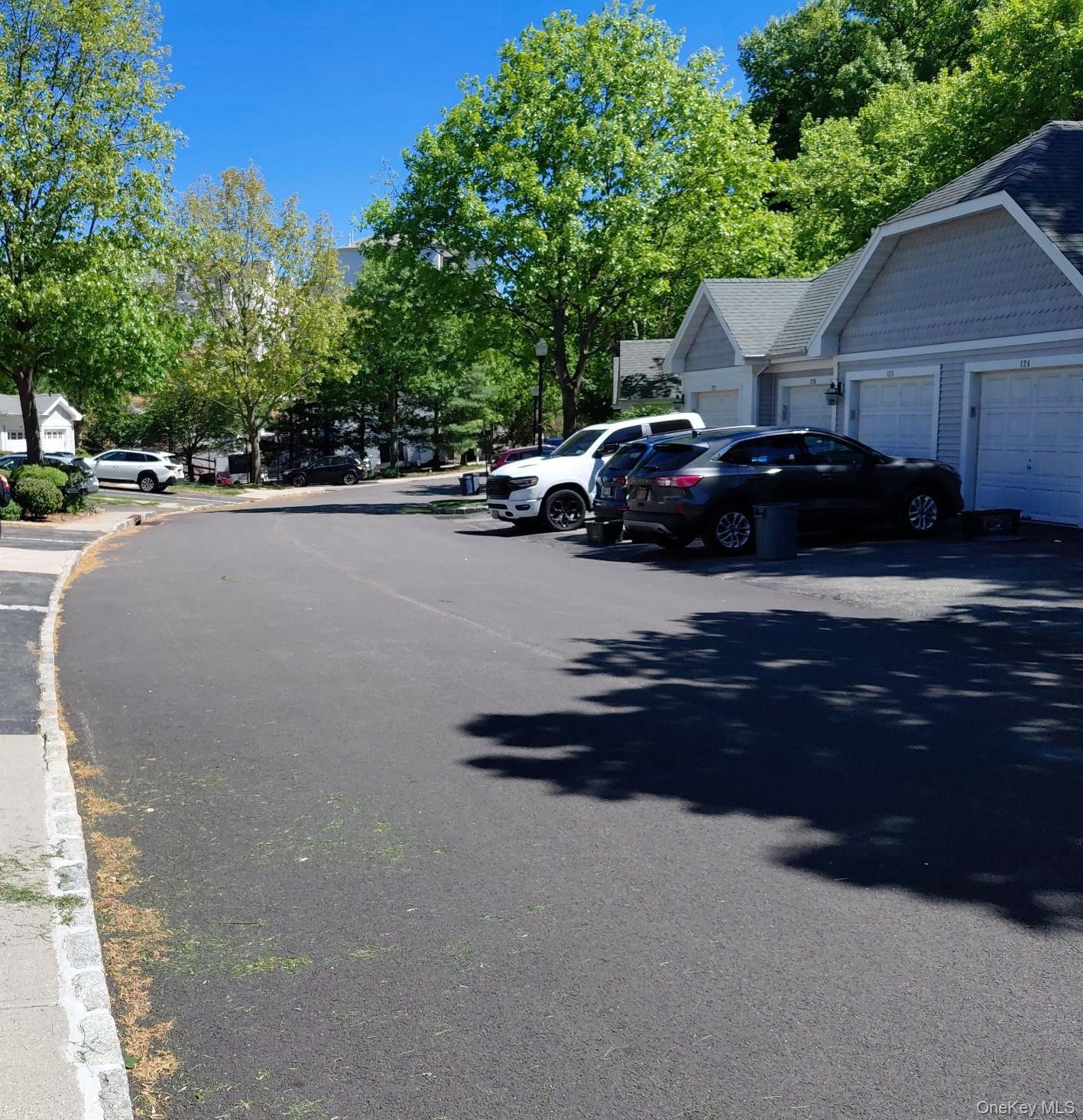 112 Riverbend Drive, Unit 88 Peekskill, NY 10566 - Photo 4 of 4 a view of street with parked cars