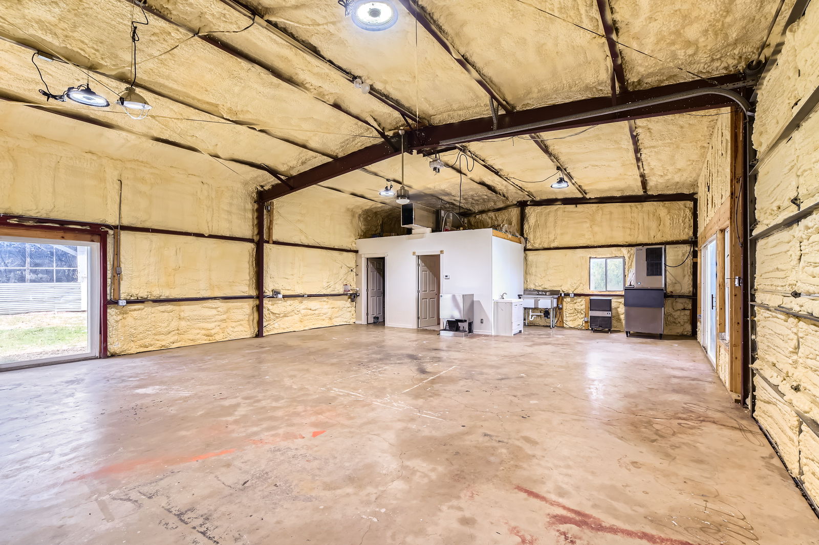 480 Grandpa Road Lockhart, TX 78644 - Photo 23 of 35 A ~1,200 sq ft workshop offers both utility and comfort, complete
with heating and cooling, foam insulation, a commercial sink, and a full bath, making it a dream space for work or
play