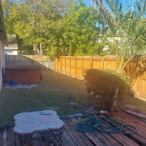 a view of backyard with wooden floor