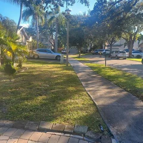 a view of a yard with swimming pool