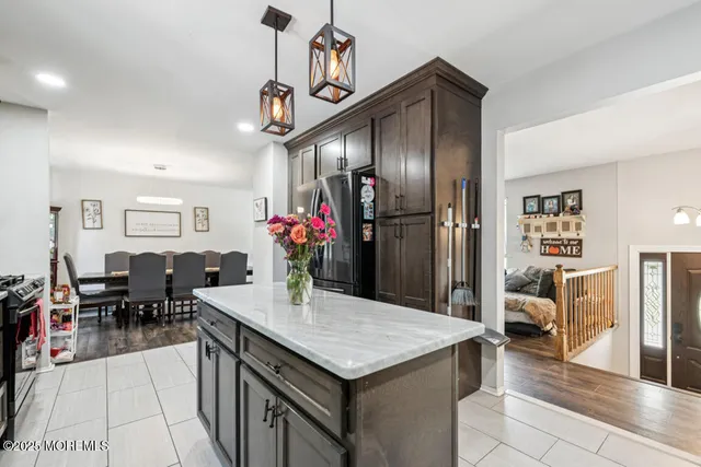 a backyard of a house with table and chairs