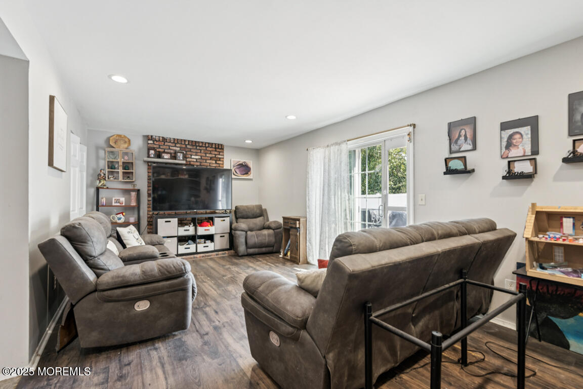 9 Cove Court Howell, NJ 07731 - Photo 11 of 20 a living room with furniture and a flat screen tv