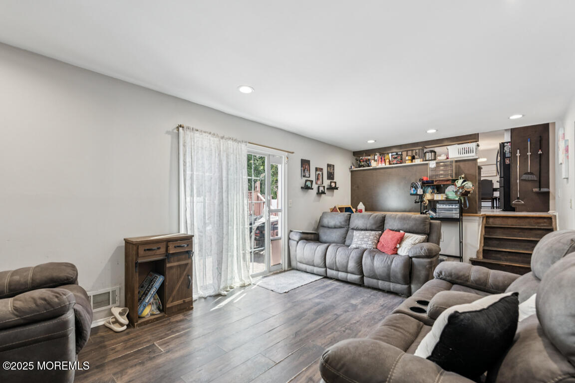 9 Cove Court Howell, NJ 07731 - Photo 12 of 20 a living room with furniture and a flat screen tv