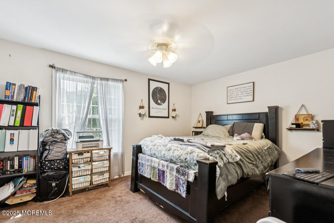 9 Cove Court Howell, NJ 07731 - Photo 13 of 20 a bedroom with a bed and a window