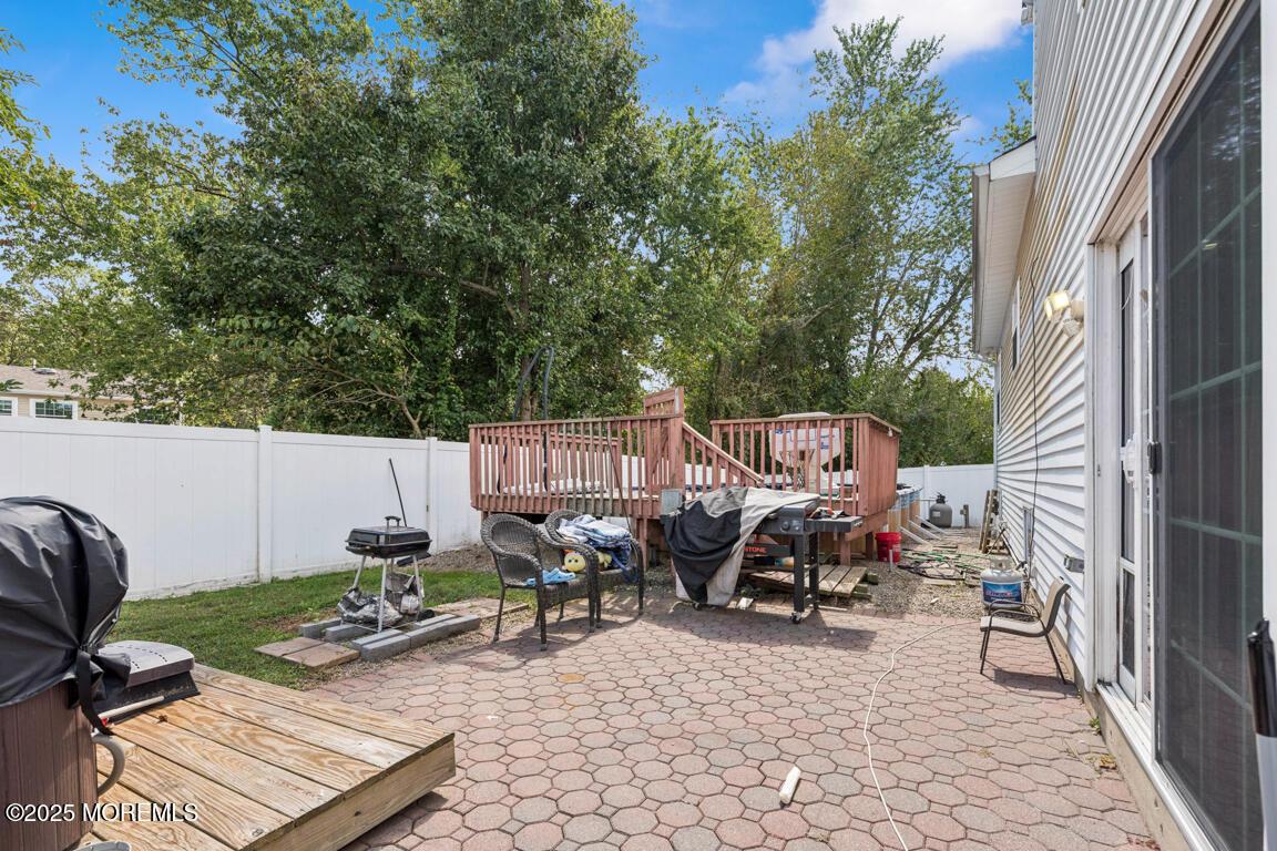 9 Cove Court Howell, NJ 07731 - Photo 17 of 20 a view of a bench in a patio