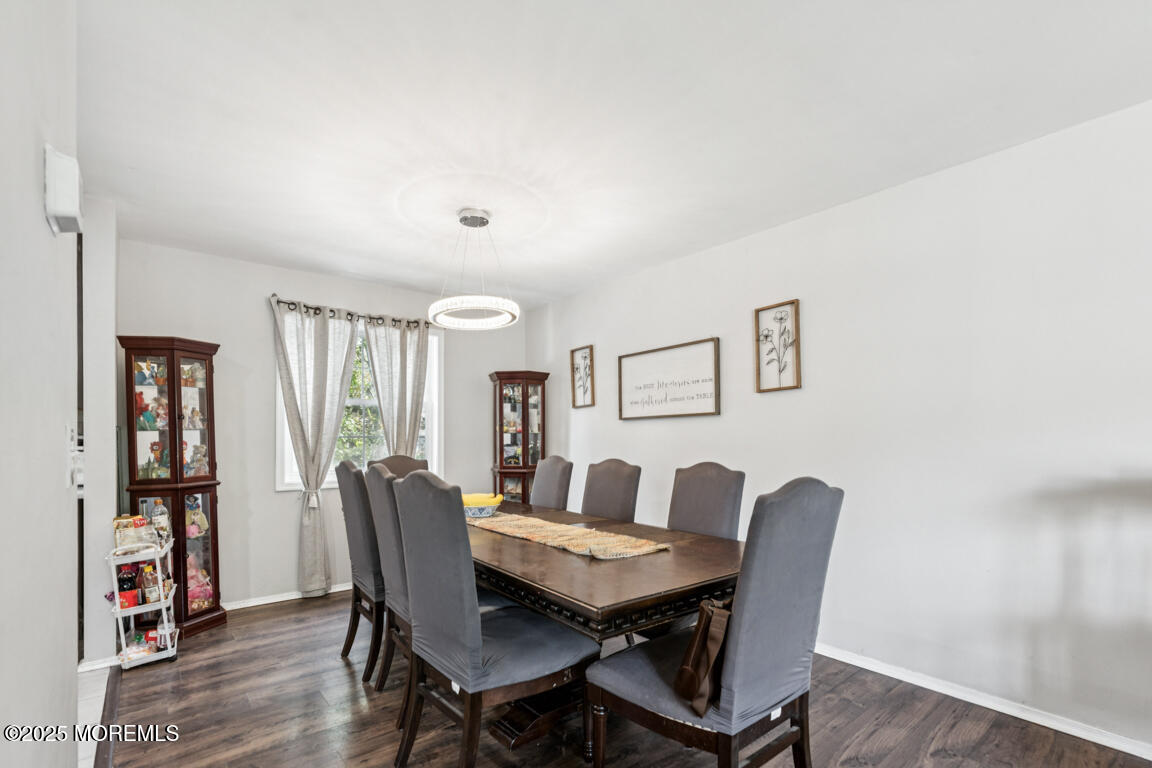 9 Cove Court Howell, NJ 07731 - Photo 7 of 20 a view of a dining room with furniture and wooden floor