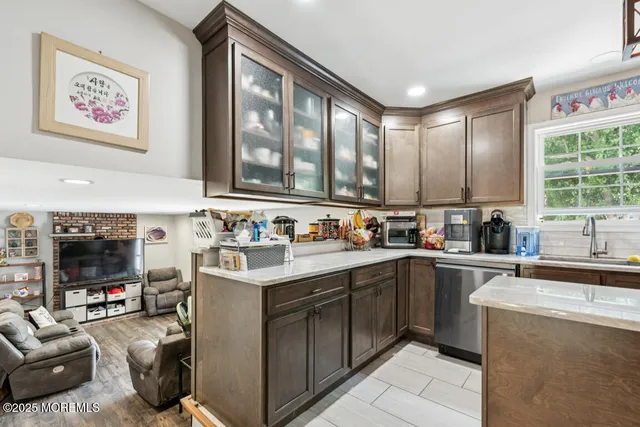 a kitchen with a sink stove and cabinets