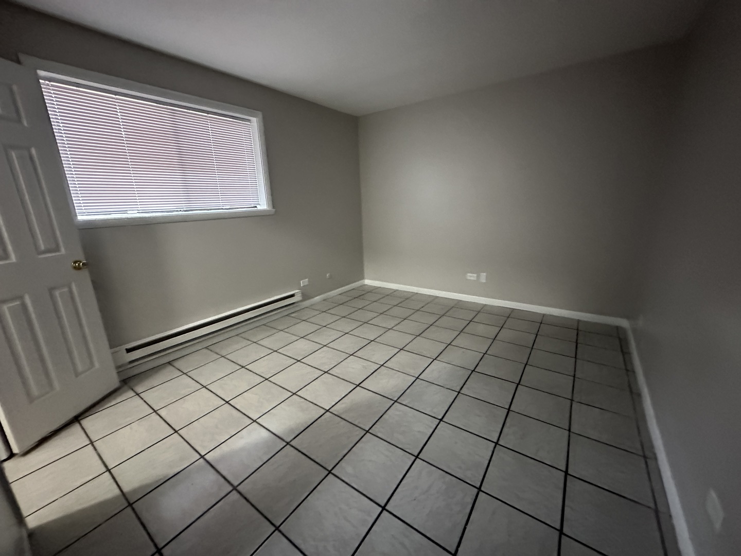 1751 Felten Road, Unit 1 Aurora, IL 60505 - Photo 4 of 12 a view of an empty room and window