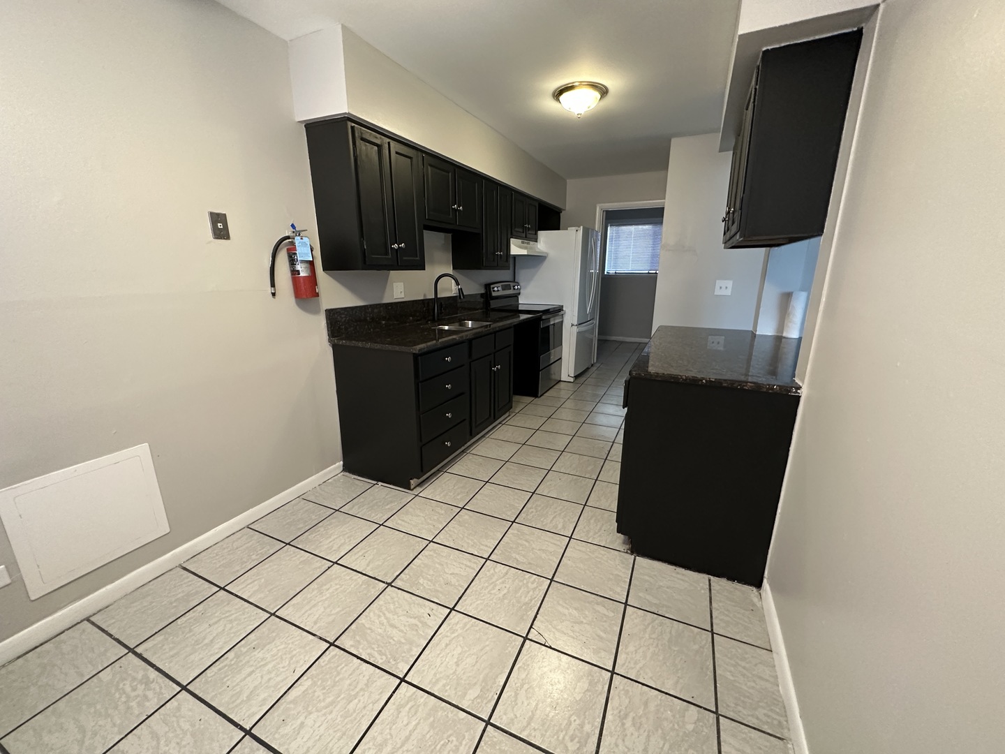 1751 Felten Road, Unit 1 Aurora, IL 60505 - Photo 8 of 12 a kitchen with stainless steel appliances a refrigerator and microwave