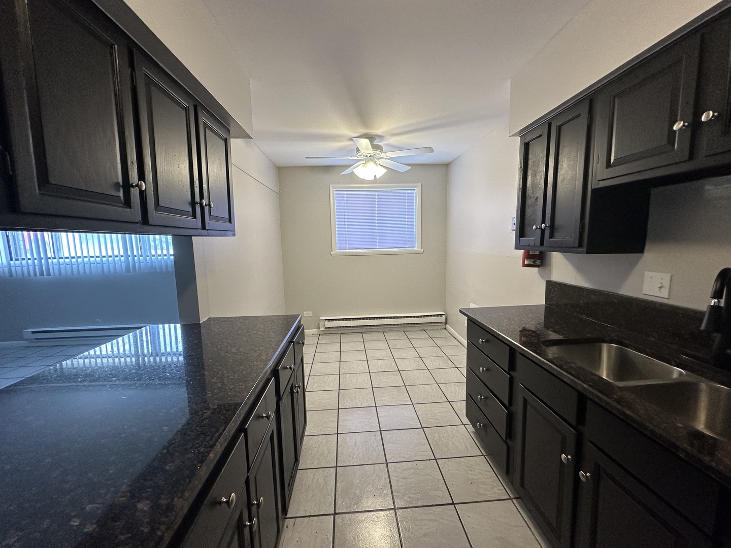 1751 Felten Road, Unit 1 Aurora, IL 60505 - Photo 9 of 12 a kitchen with stainless steel appliances granite countertop a sink stove and cabinets