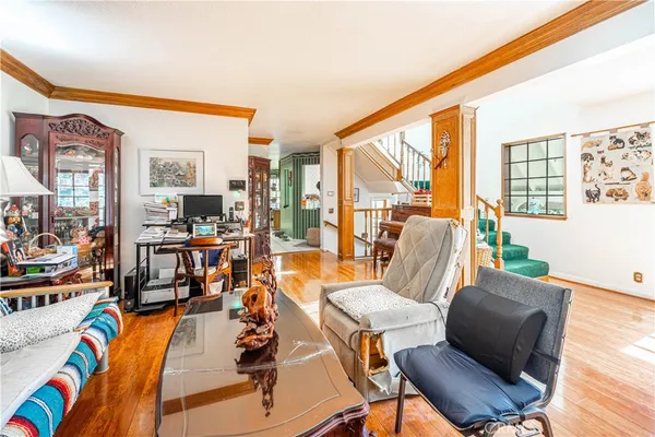 a dining room with furniture water view and a large window