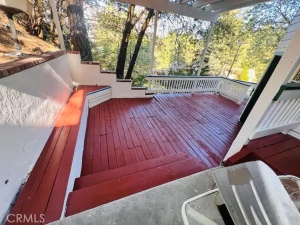 a front view of a house with a large window