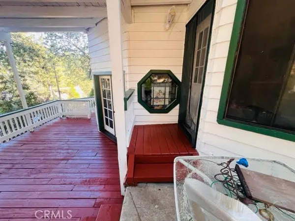 a view of swimming pool with a deck and a yard